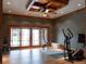 Bright home gym with exercise equipment and sliding glass doors to the outside at 6455 Dakota Ridge Dr, Golden, CO 80403