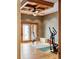 This home gym has light hardwood floors, a ceiling fan, and french doors leading to the outside at 6455 Dakota Ridge Dr, Golden, CO 80403