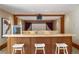 Home theater featuring popcorn machine, countertop with seating and a large movie screen at 6455 Dakota Ridge Dr, Golden, CO 80403