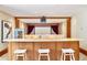 Home theater with a popcorn machine, granite countertop, stools, and a projector with a screen at 6455 Dakota Ridge Dr, Golden, CO 80403