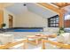 Bright sunroom featuring an indoor pool and comfortable seating for relaxation and entertaining at 6455 Dakota Ridge Dr, Golden, CO 80403