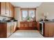Butlers Pantry with custom cabinets, granite countertops, and a beverage refrigerator at 6455 Dakota Ridge Dr, Golden, CO 80403