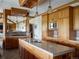 Spacious kitchen island with modern stainless steel appliances, custom cabinetry and a pass-through bar at 6455 Dakota Ridge Dr, Golden, CO 80403