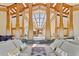 Expansive living room featuring striking architectural beams, skylights, and elegant furnishings, offering a bright, open space at 6455 Dakota Ridge Dr, Golden, CO 80403
