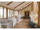 Spacious living room with high ceilings, a piano, fireplace and large windows with a view at 6455 Dakota Ridge Dr, Golden, CO 80403