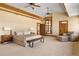 Expansive main bedroom with high ceilings, beams, and a seating area at 6455 Dakota Ridge Dr, Golden, CO 80403