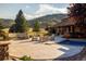 Backyard patio features a pool, spa, fire pit, outdoor seating and scenic mountain views at 6455 Dakota Ridge Dr, Golden, CO 80403