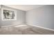 Bright bedroom features a large window and neutral carpet and paint at 18106 E Ohio Ave # 103, Aurora, CO 80017