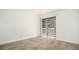 Bright bedroom features sliding doors to a balcony with natural light at 18106 E Ohio Ave # 103, Aurora, CO 80017