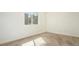 Light-filled bedroom features a large window and neutral paint and carpet at 18106 E Ohio Ave # 103, Aurora, CO 80017