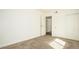 Bedroom with soft carpet features sliding closet doors and attached bathroom at 18106 E Ohio Ave # 103, Aurora, CO 80017
