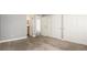 Bedroom boasts plush carpeting, closet and connected bathroom entrances at 18106 E Ohio Ave # 103, Aurora, CO 80017