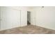 Bedroom boasts plush carpeting, sliding closet doors and an open doorway at 18106 E Ohio Ave # 103, Aurora, CO 80017