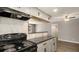 Well-equipped kitchen with tile backsplash and updated appliances at 18106 E Ohio Ave # 103, Aurora, CO 80017