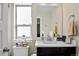 Bathroom featuring a vanity with a white countertop, sink, and mirror at 2521 Moline St, Aurora, CO 80010