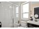 Bathroom featuring a glass door shower, toilet, and a large sink at 2521 Moline St, Aurora, CO 80010
