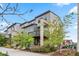 Beautifully landscaped modern townhome with stone accents, a balcony, and attractive curb appeal at 2521 Moline St, Aurora, CO 80010