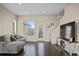 Comfortable living room with plush sofa, hardwood floors, and lots of natural light at 2521 Moline St, Aurora, CO 80010