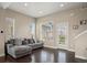 Bright living room with hardwood floors, lots of natural light, and a comfortable couch at 2521 Moline St, Aurora, CO 80010