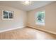 Sunlit room with hardwood floors and bright windows at 1010 Ash St, Broomfield, CO 80020
