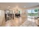 Sunlit dining room featuring access to the outdoor deck with a modern chandelier at 1010 Ash St, Broomfield, CO 80020
