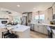 Open kitchen with stainless appliances and granite counters at 1010 Ash St, Broomfield, CO 80020
