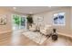 Cozy living room with sliding door leading to the outdoor deck with ample sunlight at 1010 Ash St, Broomfield, CO 80020