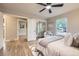 Well-lit bedroom with mirrored closet, wood floors, and neutral paint at 1010 Ash St, Broomfield, CO 80020