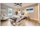 Comfortable bedroom features ample natural light with wood floors and neutral tones at 1010 Ash St, Broomfield, CO 80020
