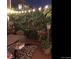 Inviting backyard deck with a dining set, potted plants, and decorative outdoor rug at 6502 Shea Pl, Highlands Ranch, CO 80130
