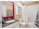 Well-lit bathroom with a granite vanity, tiled shower, and ample storage space at 6502 Shea Pl, Highlands Ranch, CO 80130