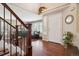 Inviting foyer with hardwood floors, a staircase and natural light at 6502 Shea Pl, Highlands Ranch, CO 80130