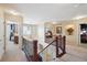 Spacious second-floor hallway with natural light, carpet, and views into bedrooms at 6502 Shea Pl, Highlands Ranch, CO 80130