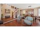 Open-concept living room featuring hardwood floors, staircase and dining area at 6502 Shea Pl, Highlands Ranch, CO 80130