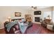 Elegant living room features a fireplace, leather sofa, and classic decor at 6502 Shea Pl, Highlands Ranch, CO 80130