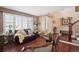 Comfortable living area with hardwood floors and a cozy seating arrangement at 6502 Shea Pl, Highlands Ranch, CO 80130