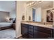 Bathroom featuring granite countertop on vanity with a view into the main bedroom at 42830 Ivydel St, Elizabeth, CO 80107