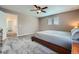 Neutral bedroom with carpet, natural light, and view of ensuite bathroom at 42830 Ivydel St, Elizabeth, CO 80107