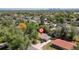 Birds eye shot shows the house in the neighborhood at 140 S Kendall St, Lakewood, CO 80226