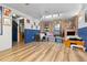 Finished basement featuring brick fireplace and wood-look flooring at 140 S Kendall St, Lakewood, CO 80226