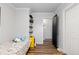 The bedroom boasts wood flooring and an open doorway to another room at 140 S Kendall St, Lakewood, CO 80226