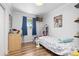 This cozy bedroom is naturally lit and decorated with a fun, playful theme at 140 S Kendall St, Lakewood, CO 80226