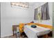 Bright dining area features a stylish light fixture and a sunny window view at 140 S Kendall St, Lakewood, CO 80226