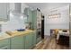 Stylish kitchen showcasing stainless steel appliances, neutral countertops, and ample storage at 140 S Kendall St, Lakewood, CO 80226