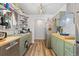 Efficient kitchen with stainless steel appliances, butcher block countertop and abundant shelving at 140 S Kendall St, Lakewood, CO 80226