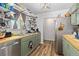 Efficient kitchen with stainless steel appliances, butcher block countertop and abundant shelving at 140 S Kendall St, Lakewood, CO 80226
