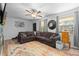Cozy living room with comfortable couch, colorful rug, and unique decor touches at 140 S Kendall St, Lakewood, CO 80226