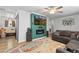 Comfortable living room featuring a cozy couch, a modern fireplace, and an open layout at 140 S Kendall St, Lakewood, CO 80226