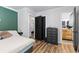 This main bedroom offers a sneak peek into the bathroom and other bedrooms in the home at 140 S Kendall St, Lakewood, CO 80226