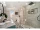 Modern bathroom featuring a soaking tub, walk-in shower, patterned tile floor, and granite countertop at 6532 S Field Way, Littleton, CO 80123